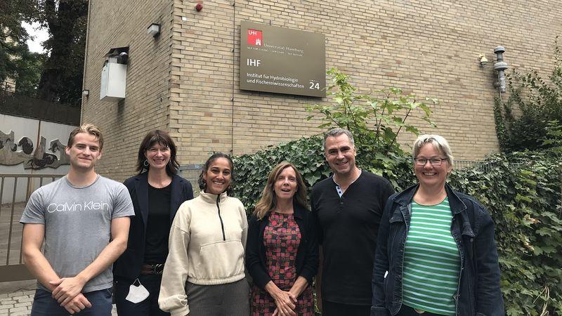 Group picture of the SHIRE project partners in front of a brown brick building.