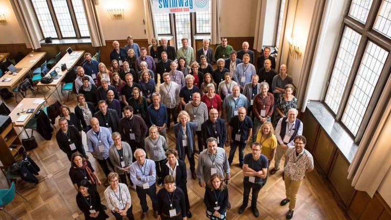 Group picture of conference participants taken from a higher angle.